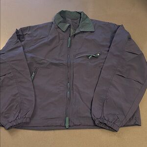 New Navy Windbreaker with Green lining and accents.
